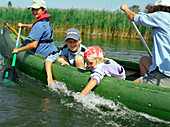 Canoe tour with children on Prerowstrom, Hertesburg, Fischland-Darss-Zingst, Mecklenburg-Western Pomerania, Germany