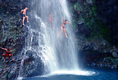 Woman jumping in waterfall, Falls of Balleine, St. Vincent, Caribbean, America