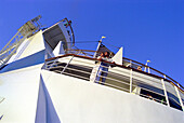 Young couple standing at railing of cruise ship AIDA, Caribbean, America