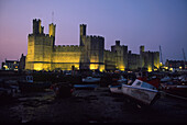 The illuminated castle of Caernafon at night, Wales, Great Britain, Europe
