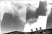 Three male mountain bikers on the way, Dolomites, Italy