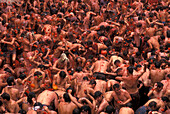 Crowds of people celebrating the tomato festival, Tomatina, Bunol, Valencia, Spain