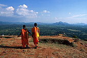 Two Monks on Sigiriya Rock, Lion's rock, an ancient rock fortress, Sigiriya, Sri Lanka