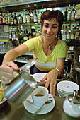 Woman preparing Cappuccino, Bar Mateo, Corniglia, Cinque Terre, Liguria, Italy
