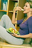 Woman eating an Apple