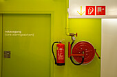 Extinguisher near emergency exit
