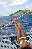 Woman sunbathing, woman on boat british virgin islands