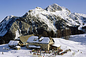 People in front of an alpine hut in the sunlight, Karnische Alpen, Bernese Oberland, Switzerland