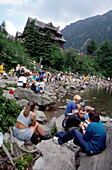 Hikers near chalet at Morskie Oko Lake, High Tatras, Poland