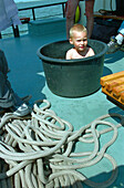 Boy has a bath, Pelikaan, Ameland, Wadden Sea Netherlands
