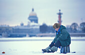 Ice fishing on the Neva River, St. Petersburg Russia