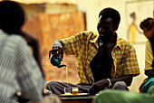 Men drinking tea, Gambia, Africa