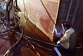 Welding steel-plates, dry dock, Queen Mary 2, Saint-Nazaire, France