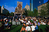 Open Air Concert, people sitting on a meadow in front of the Trinity Church, Copley Square, Boston, Massachusetts, USA, America
