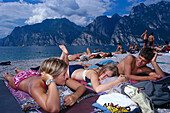 Teenagers on the Lakeside, Torbole, Lago di Garda Trentino, Italy