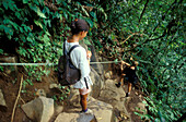 Climbing through Balneario Tabacon, La Fortuna, Costa Rica, Caribbean, Central America