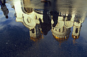 Reflection of Cathedral of Christ the Savior in a puddle, Moscow, Russia