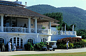 People in front of a building of the White Witch Golf Club, Rose Hall, Jamaica, Caribbean, America