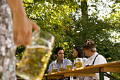Friends in beergarden, Bavaria, Germany