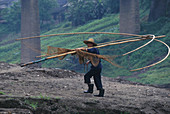 Fisherman at the banks of river Yangtsekiang, China, Asia