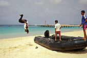 Native boys playing at beach, Beach of Santa Maria, Sal, Cape Verde Islands, Africa