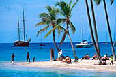 People on the beach in the sunlight, Marigot Bay, St. Lucia, Carribean, America