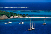 Sailing boats anchoring in a bay at Horseshoe Reef, Tobago Cays, St. Vincent, Grenadines, Caribbean, America