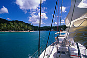 View from a sailing boat to a palm beach under blue sky, Marigot Bay, St. Lucia, Caribbean, America