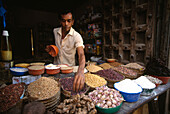 A man selling spices at the market, Zanzibar, Tanzania, Africa