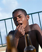 Teenager eating prawns, Cape Verde Islands