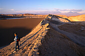 Hikers in the desert in the light of the evening sun, Valle de la Luna, Atacama desert, Chile, South America, America