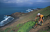 Man mountain biking, on a mountain bike tour, MTB tour, Fuerteventura, Canary Islands, Spain