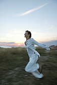 Running girl at sunset, Wellness people