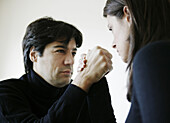 Woman and man arm wrestling, Vienna, Austria