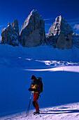 Man on skitour, Tre Cime di Lavaredo three battlements, , Dolomites, South Tyrol, Italy