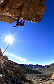 Man climbing an overhanging rock, Las Canadas, Tenerife, Spain