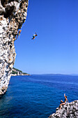 Jumping into water from rock, Deep Water Soloing, Hvar, Croatia