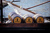 Portwineboat with barrels, Rio Douro, Porto Portugal