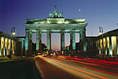 Luminous tracks through Brandenburg Gate, Berlin