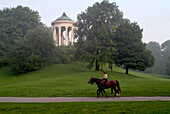 Mounted Police on Horseback in front of Monopteros in English Garden, Munich, Bavaria, Germany