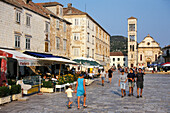 People at the market square in front of the cathedral, Hvar, Insel Hvar, Croatia, Europe