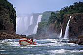 Small boat in front of Iguacu Falls, Parana, Brazil, South America, America