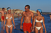 Young people on the beach, Praia da Rocha, Algarve, Portugal, Europe