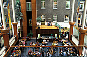 People at the terrace of a cafe at a courtyard, Powers Court Townhouse Center, Dublin, Ireland, Europe