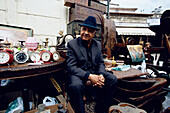 Man selling on Sunday flea market, Athens, Greece