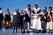 Pressing Wine Sitges, Women pressing first wine, Wine Festival, Sitges, Costa de Garraf, Spain