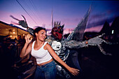 Woman dancing with disguised man, Mardi Gras, Carnival Port of Spain, Trinidad