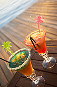 Colourful cocktails at the pool of Hotel Restaurant Le Rayon Vert, Deshaies, Basse-Terre, Guadeloupe, Caribbean Sea, America