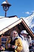 Couple in front of Obstler hut, Soelden, Oetz Valley, Tyrol, Austria, Europe