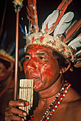 Portrait of a man with feather decorations and facial painting, Native South American Tarianos, Amazonas, Brazil